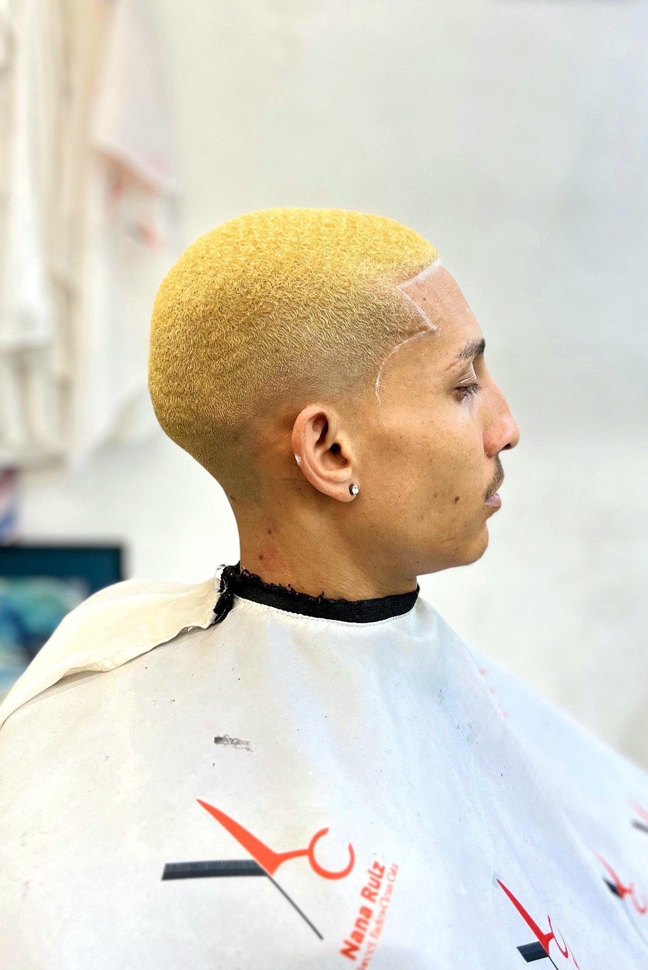 Signature blonde fade with razor-sharp line-up