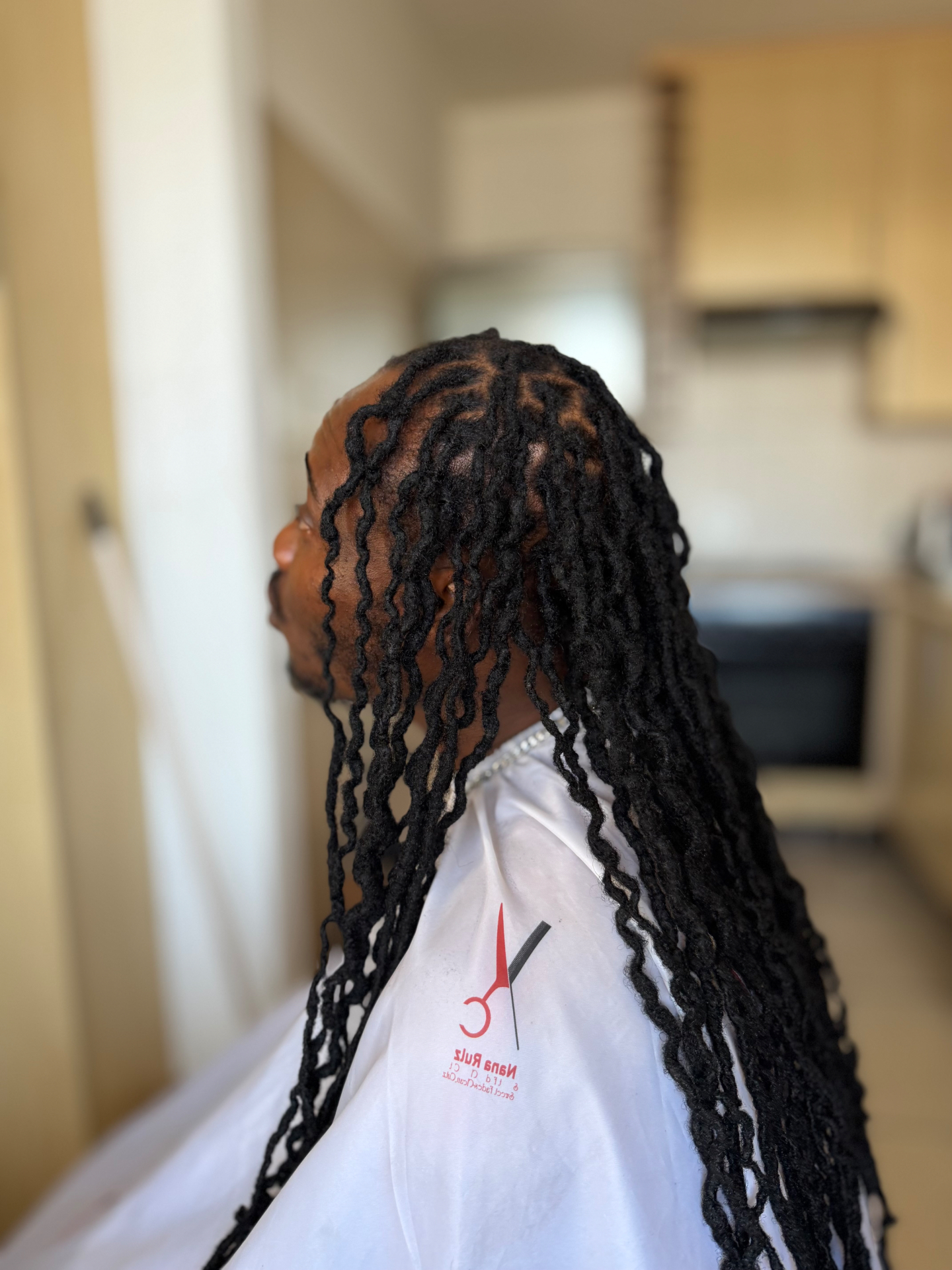 Long crochet locs styled at home